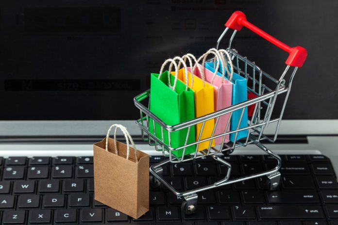 Buying goods and clothing in the online store. Shopping bags in