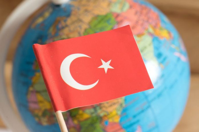111120757 - flag of turkey and a globe in the background